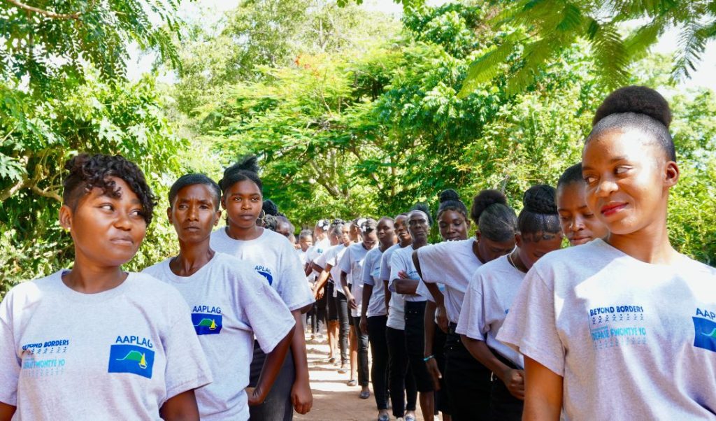 Group of people walking outdoors together.